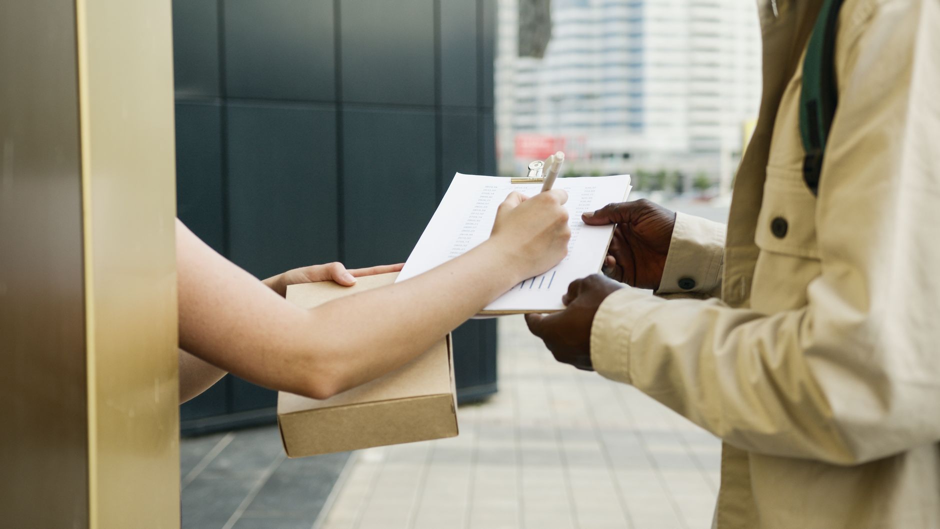 A courier delivering parcels to a small independent online seller