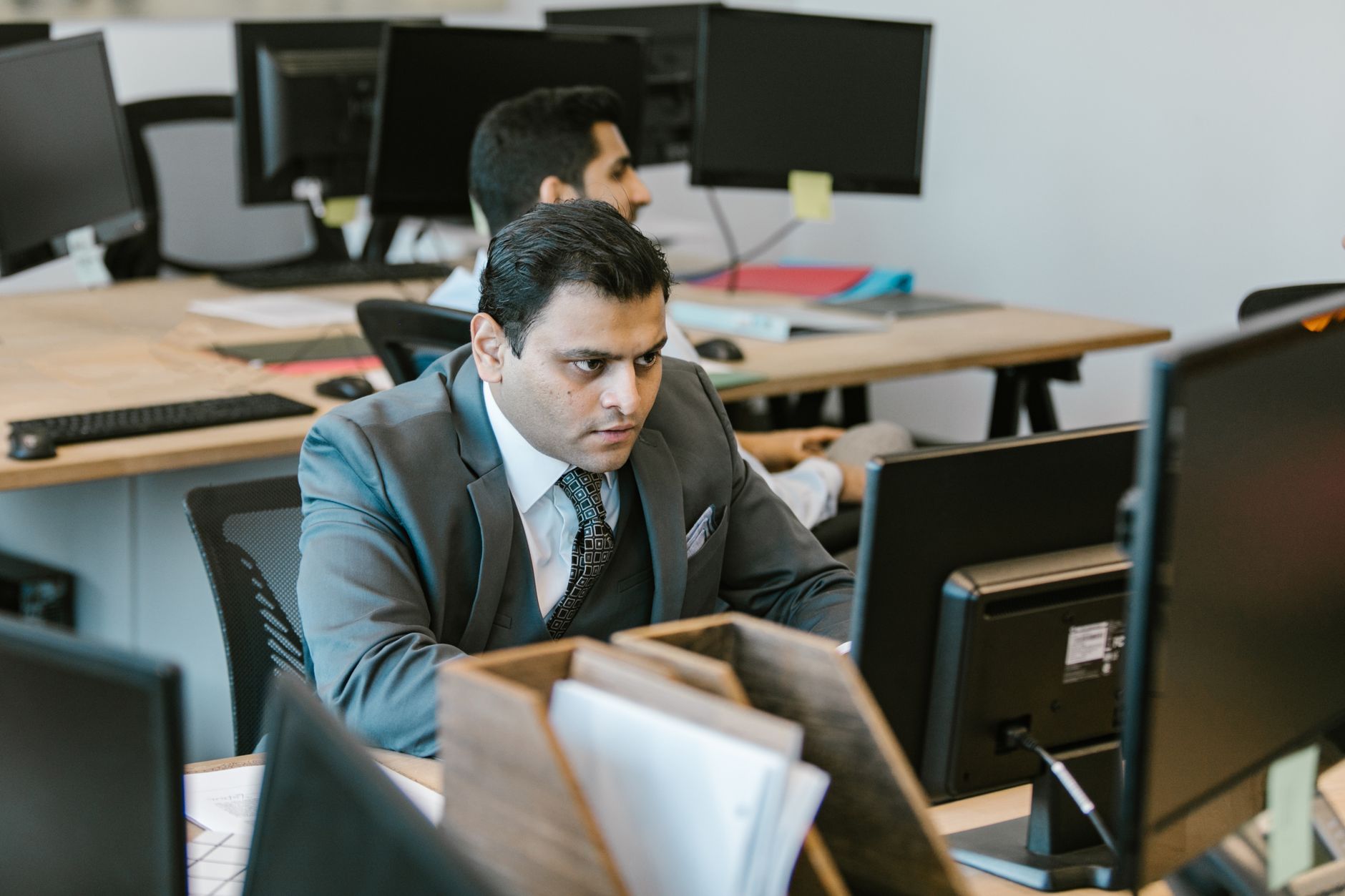 A marketer studies a single channel's analytics on one screen, focused on depth rather than juggling many platforms at once.