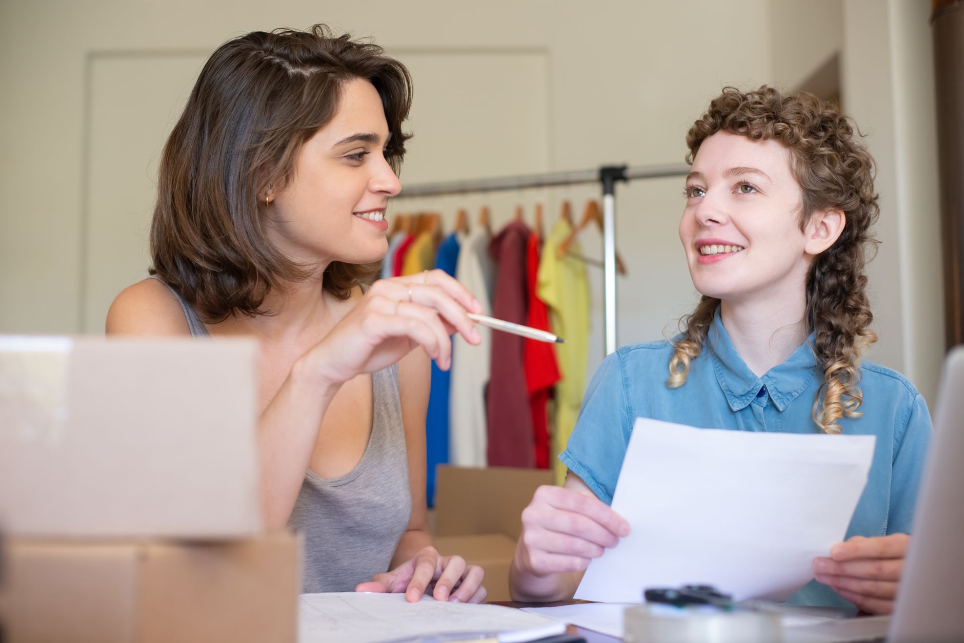 Two business partners weighing up whether to run a Black Friday sale