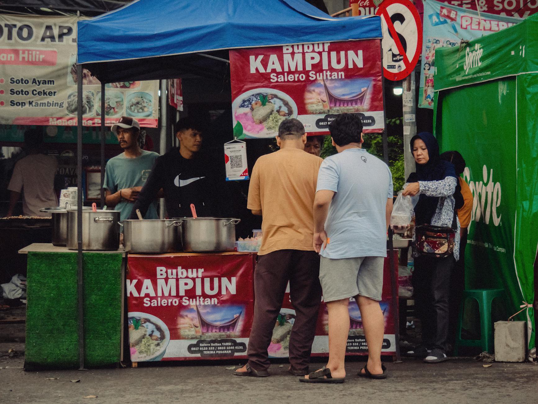 Lively street food scene at a Jakarta bazaar with diverse local cuisine.