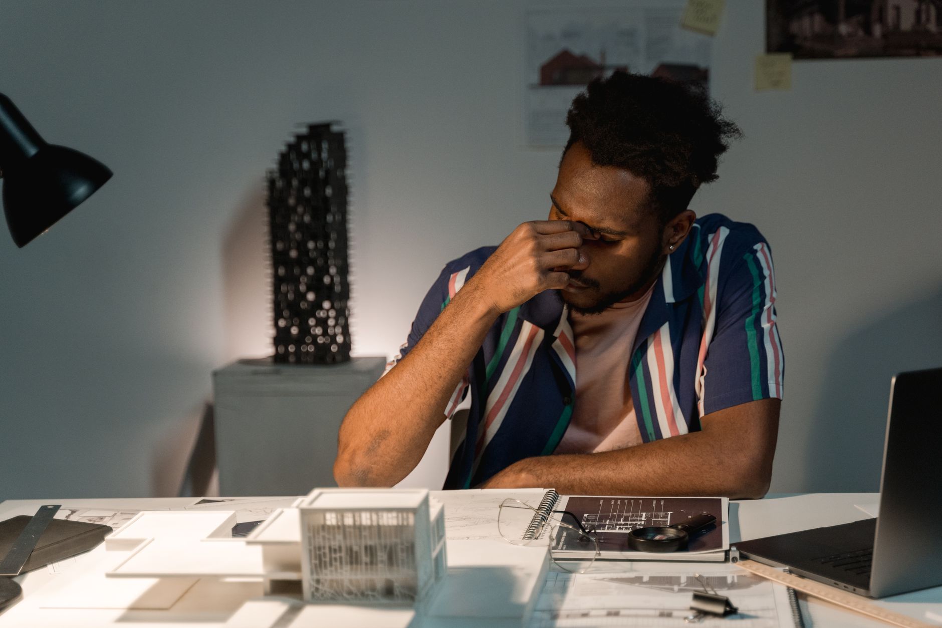 A tradesperson reviewing outdated business listings and paperwork