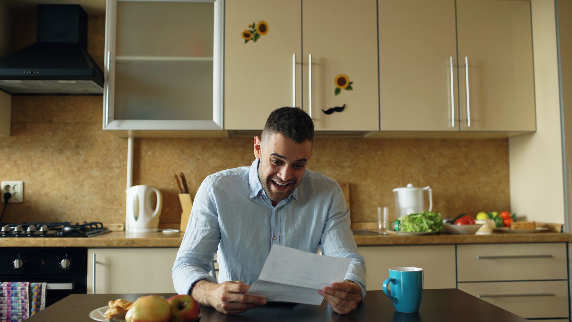 A business owner reading correspondence about consumer protection rules