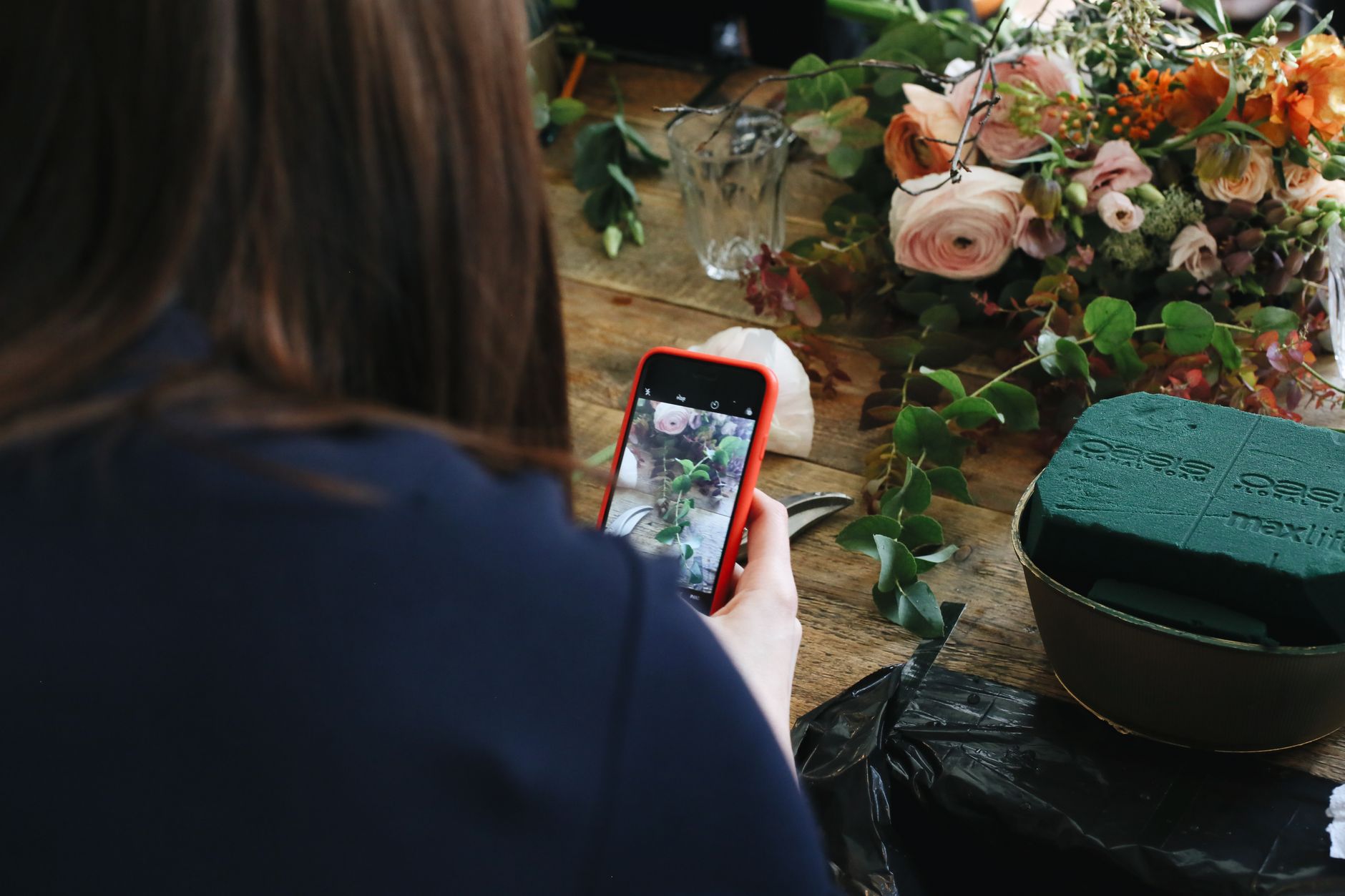 A florist preparing a giveaway post for social media