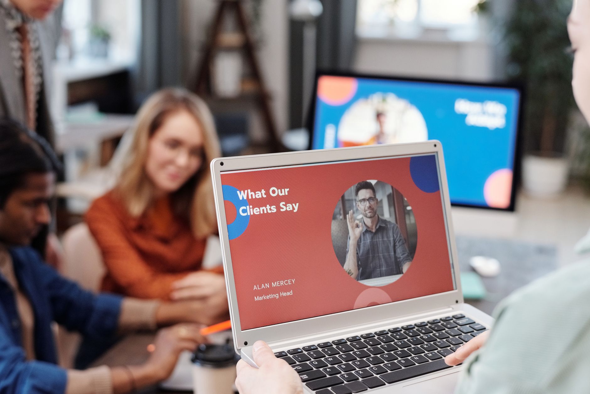 A laptop displays a course sales page featuring customer testimonials and a clear call to action, viewed by a prospective buyer.