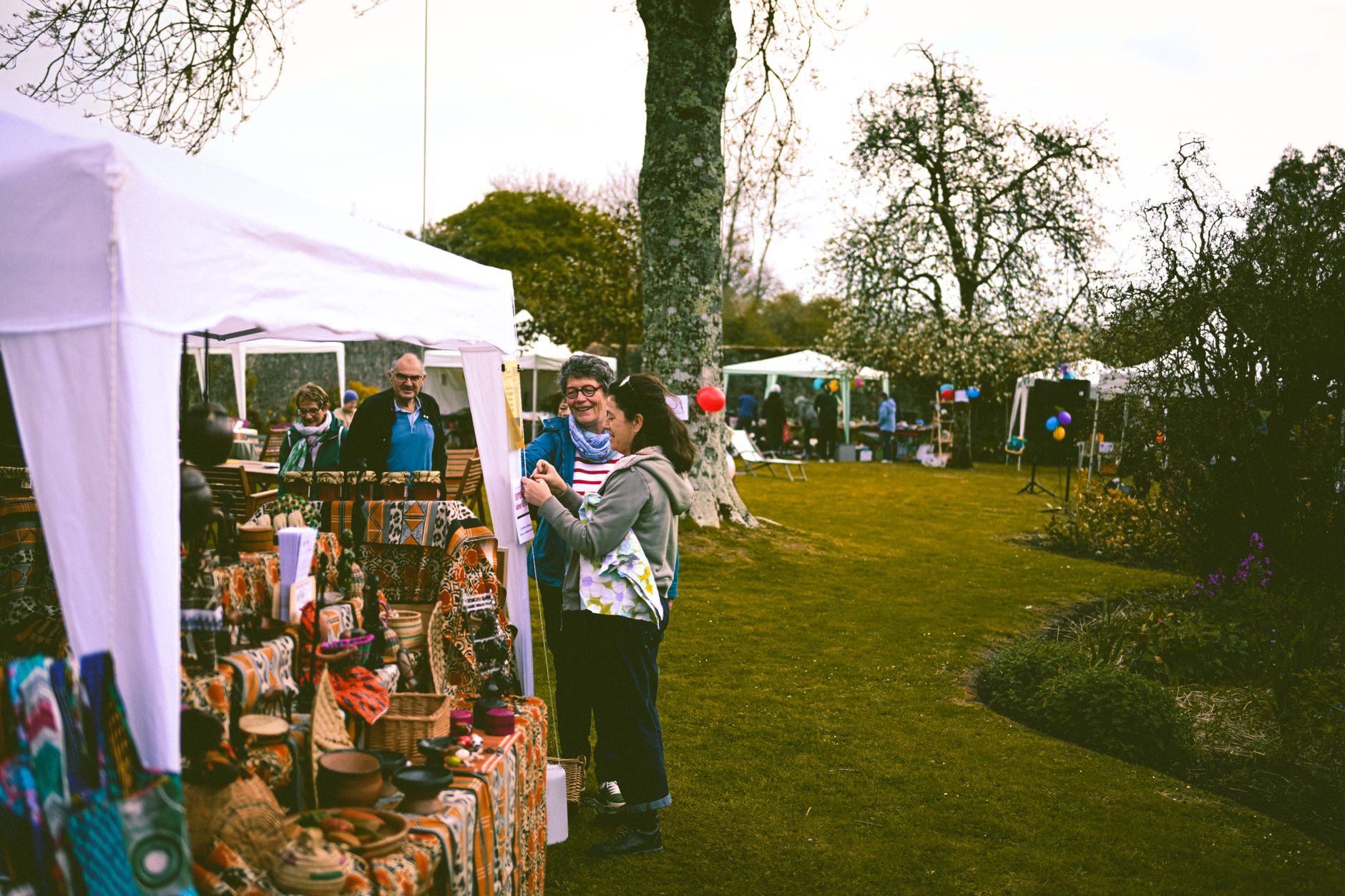 A stallholder talking to a market organiser before booking a pitch