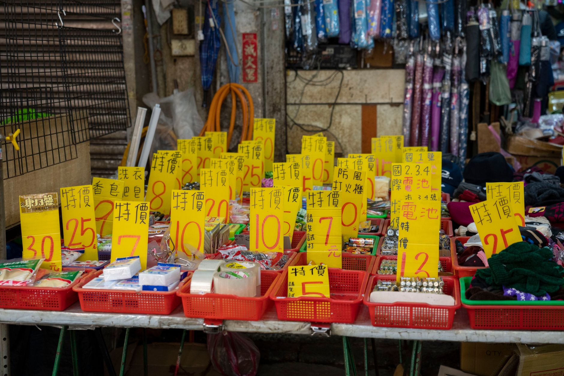 A cluttered craft stall with too much stock and unclear pricing
