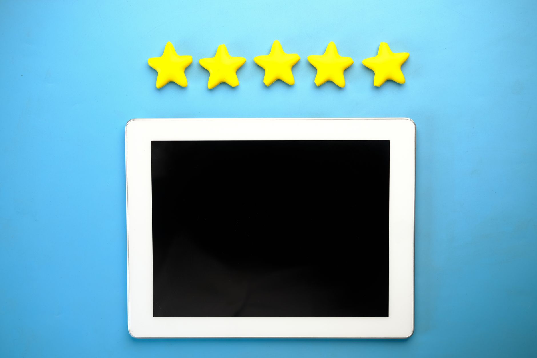 A customer taps a five star rating on a phone screen, leaving positive feedback after a smooth online purchase.
