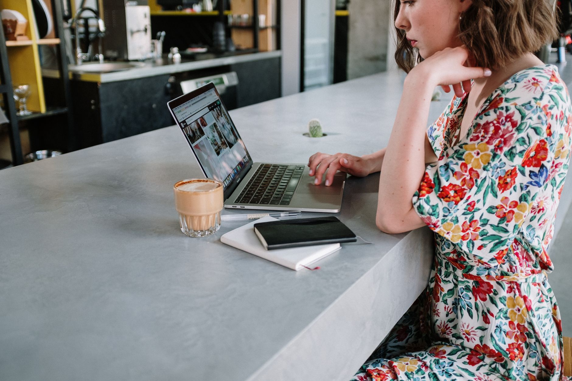 A cafe owner adding a new blog post to their website