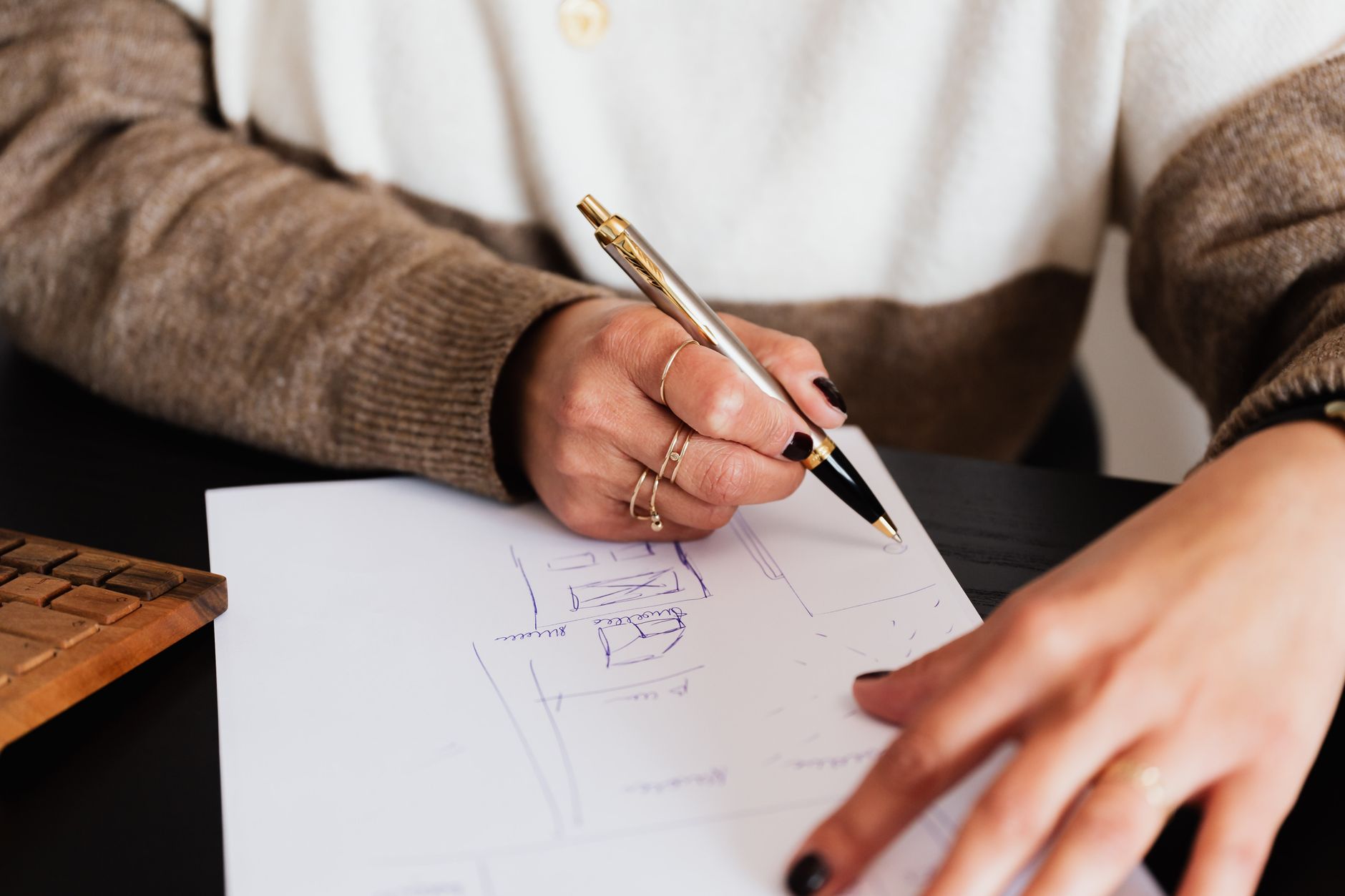 A designer planning what to write for different newsletter readers