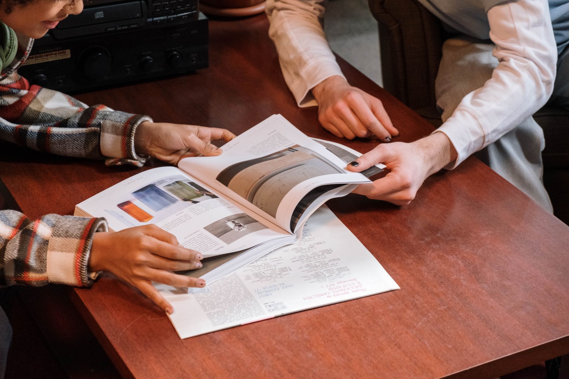 A small team reviewing the parts of a landing page together