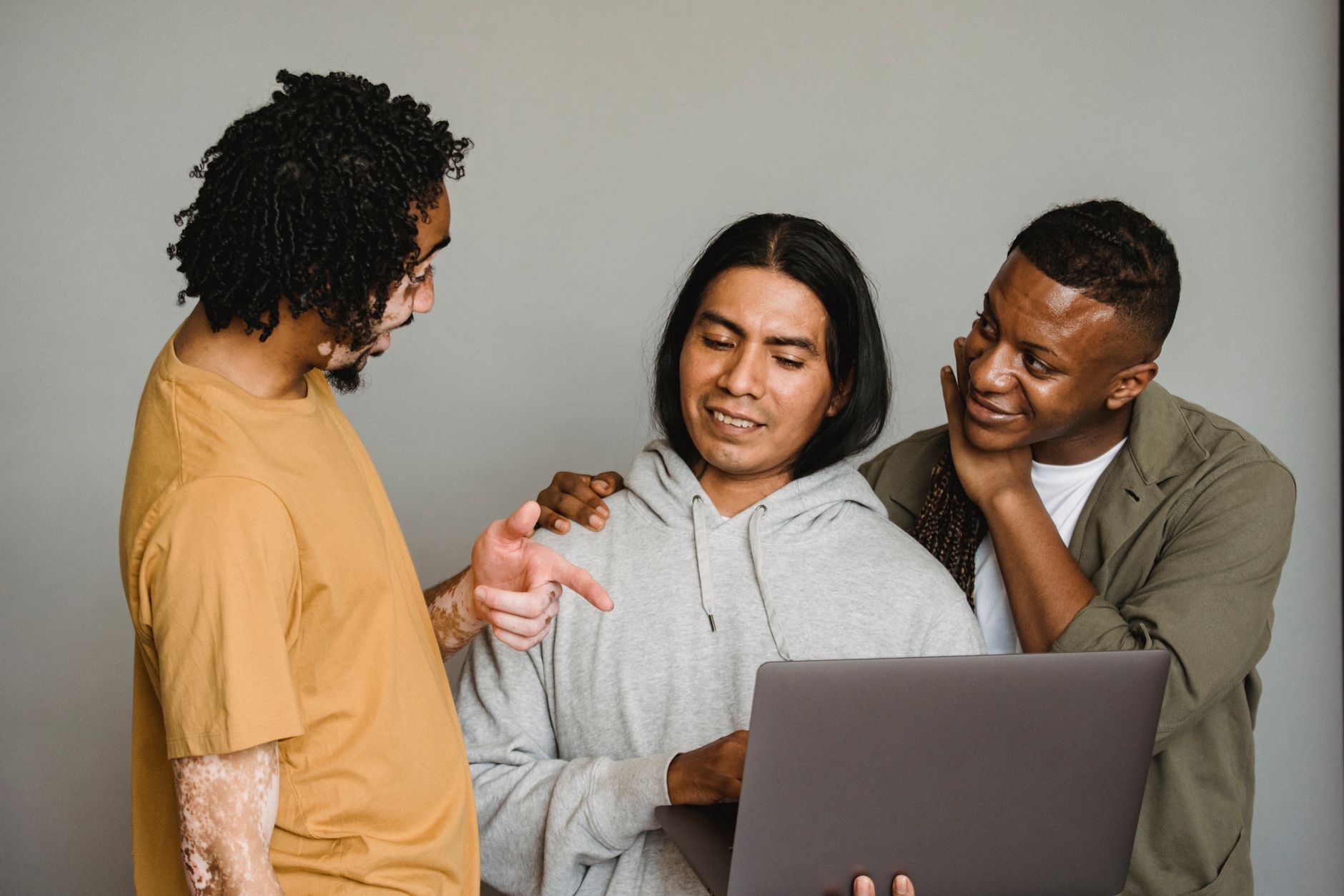 A small software team discussing their company's LinkedIn presence