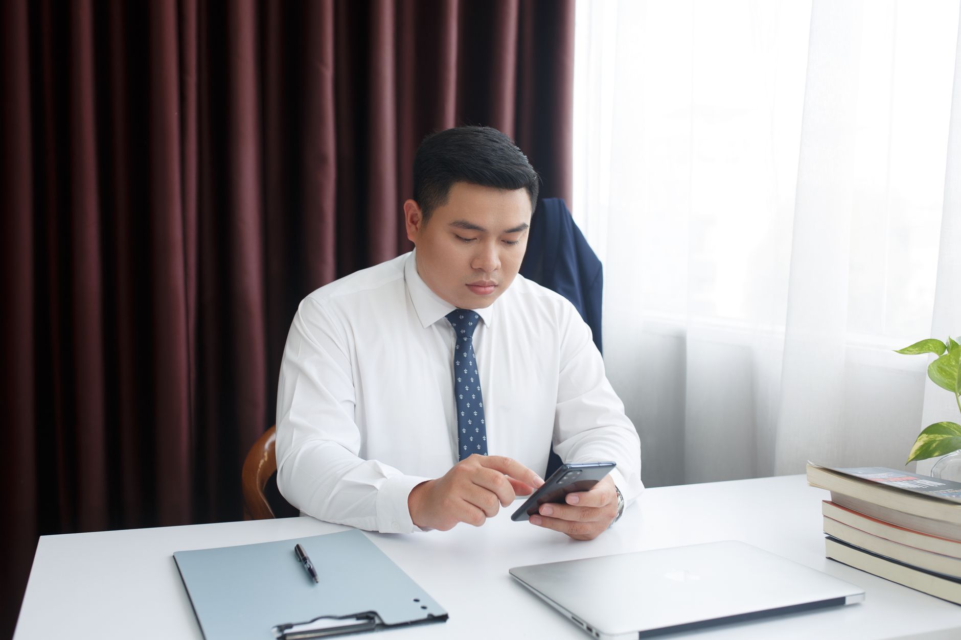 A team member recording a short video for LinkedIn at their desk