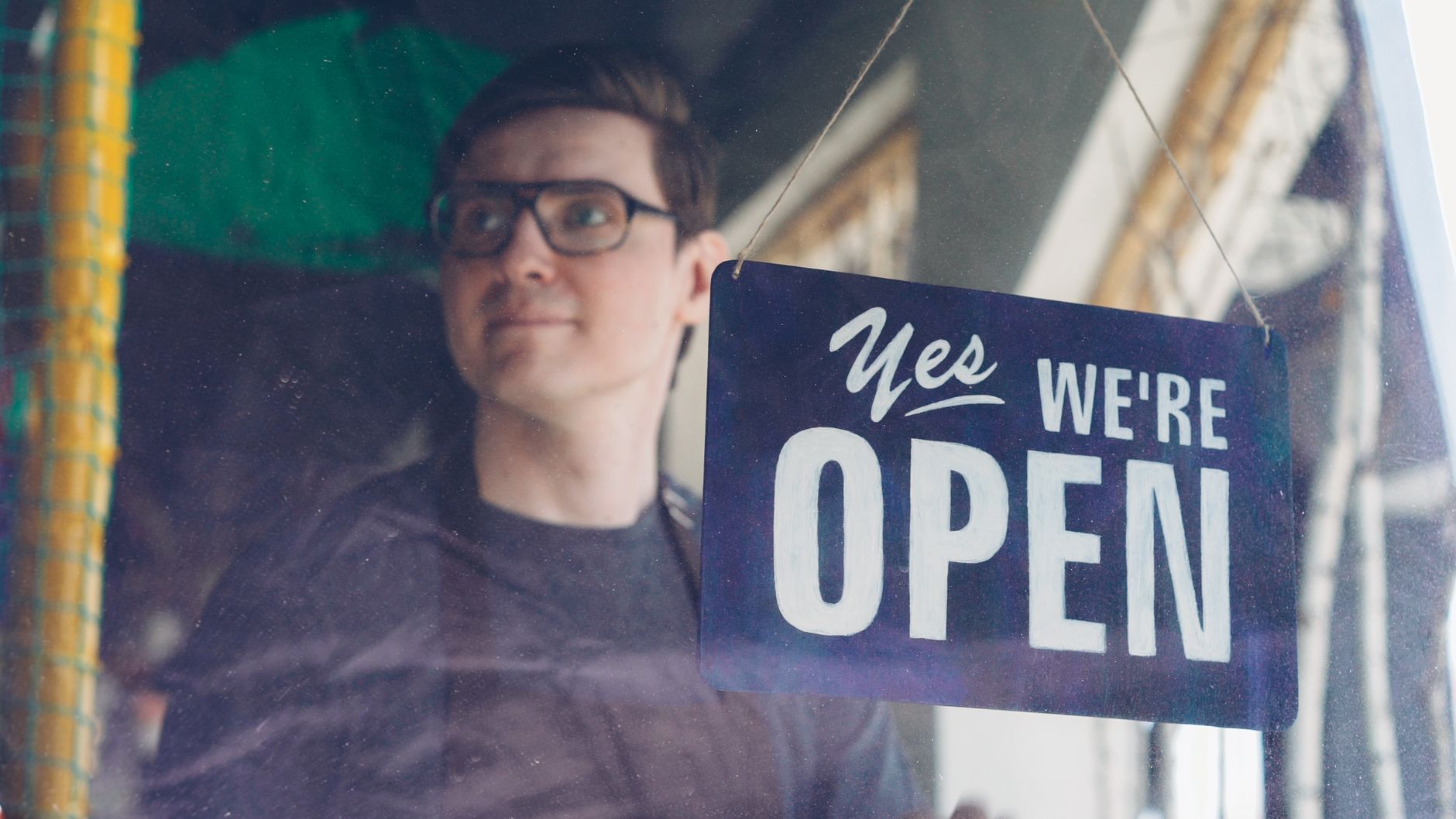An independent shop owner outside a business that has traded locally for years