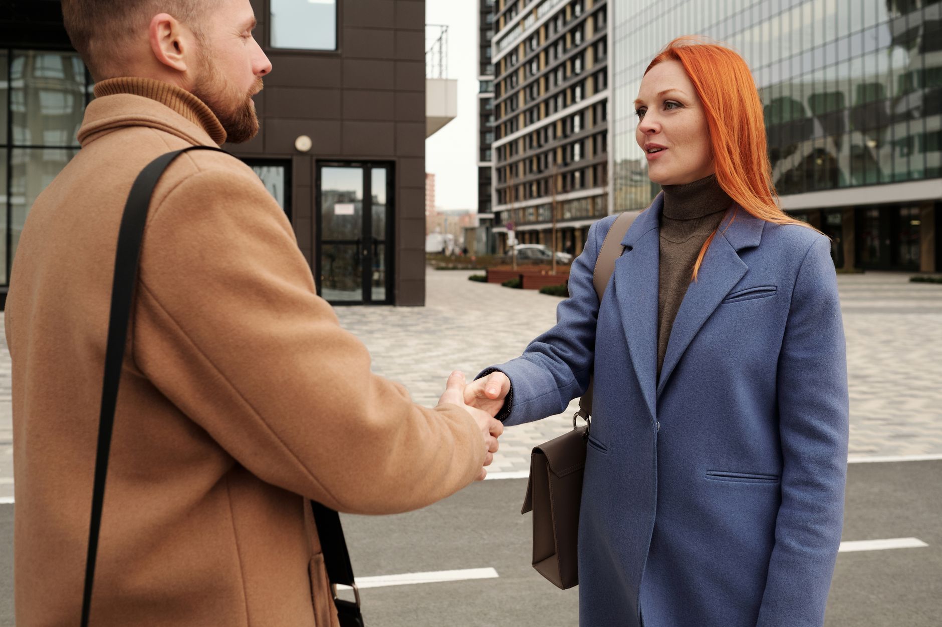 A small business owner greeting a local journalist they know by name