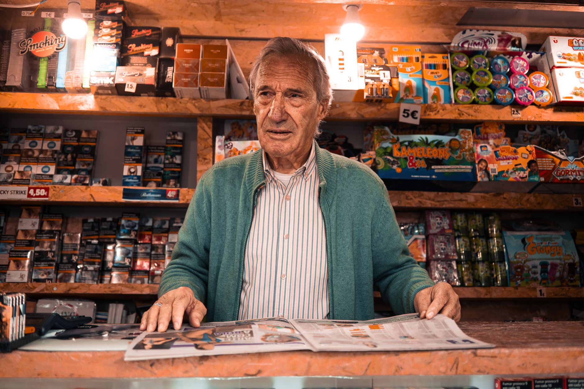 A small business owner sharing a local newspaper story about their business
