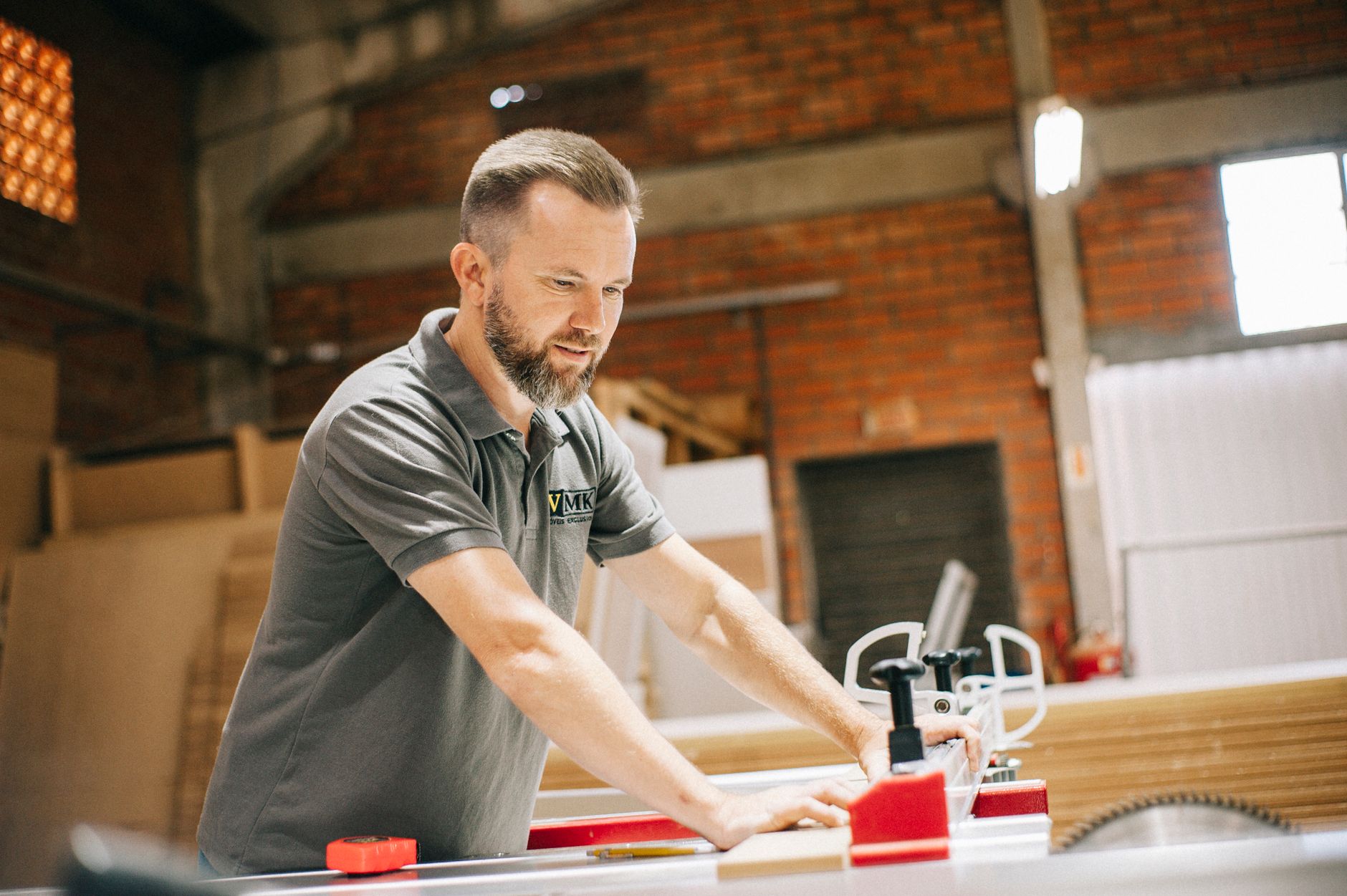 A furniture maker beside a van showing a simple consistent logo
