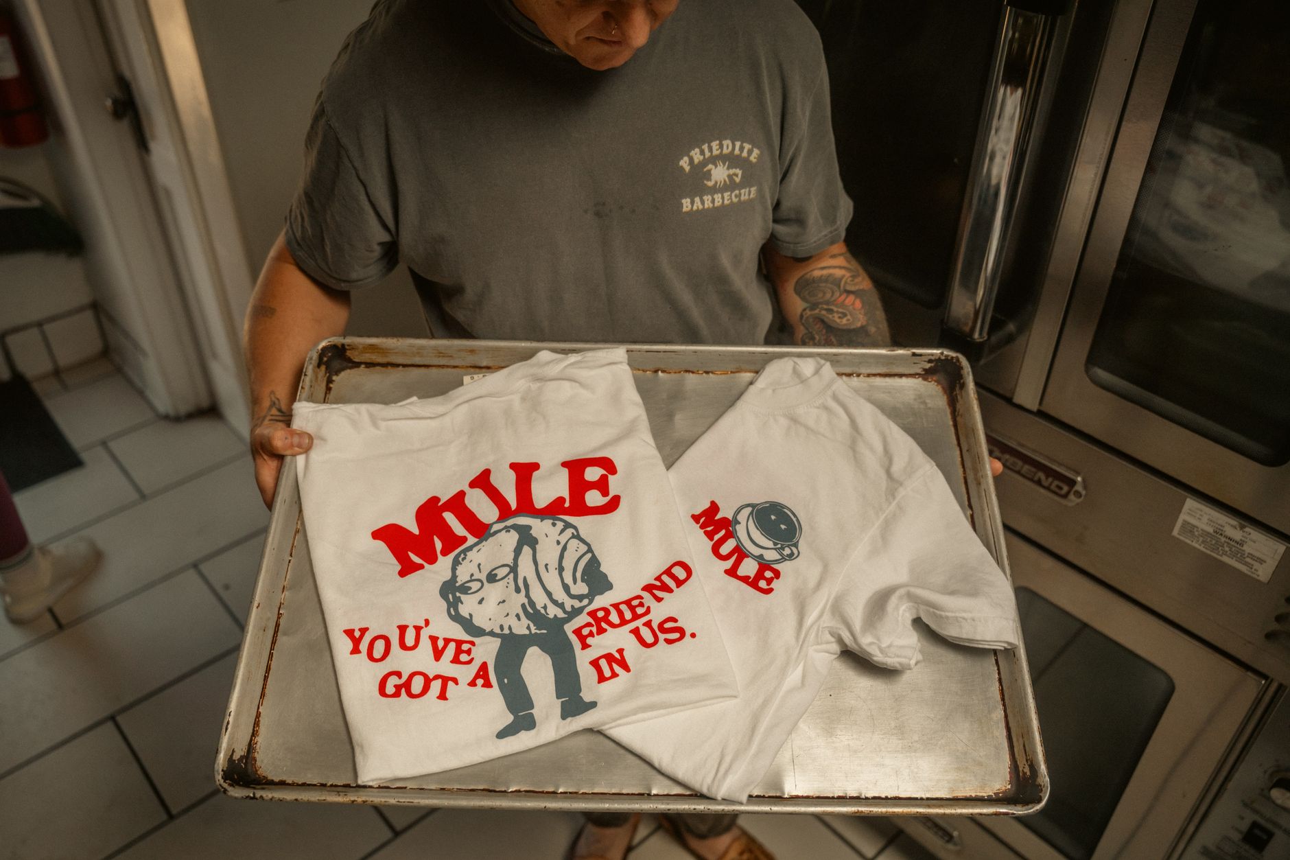 A designer comparing a logo printed at several different sizes
