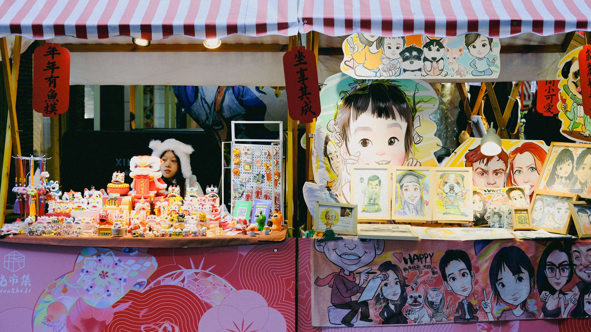 An artist packing a piece for a customer at a craft market