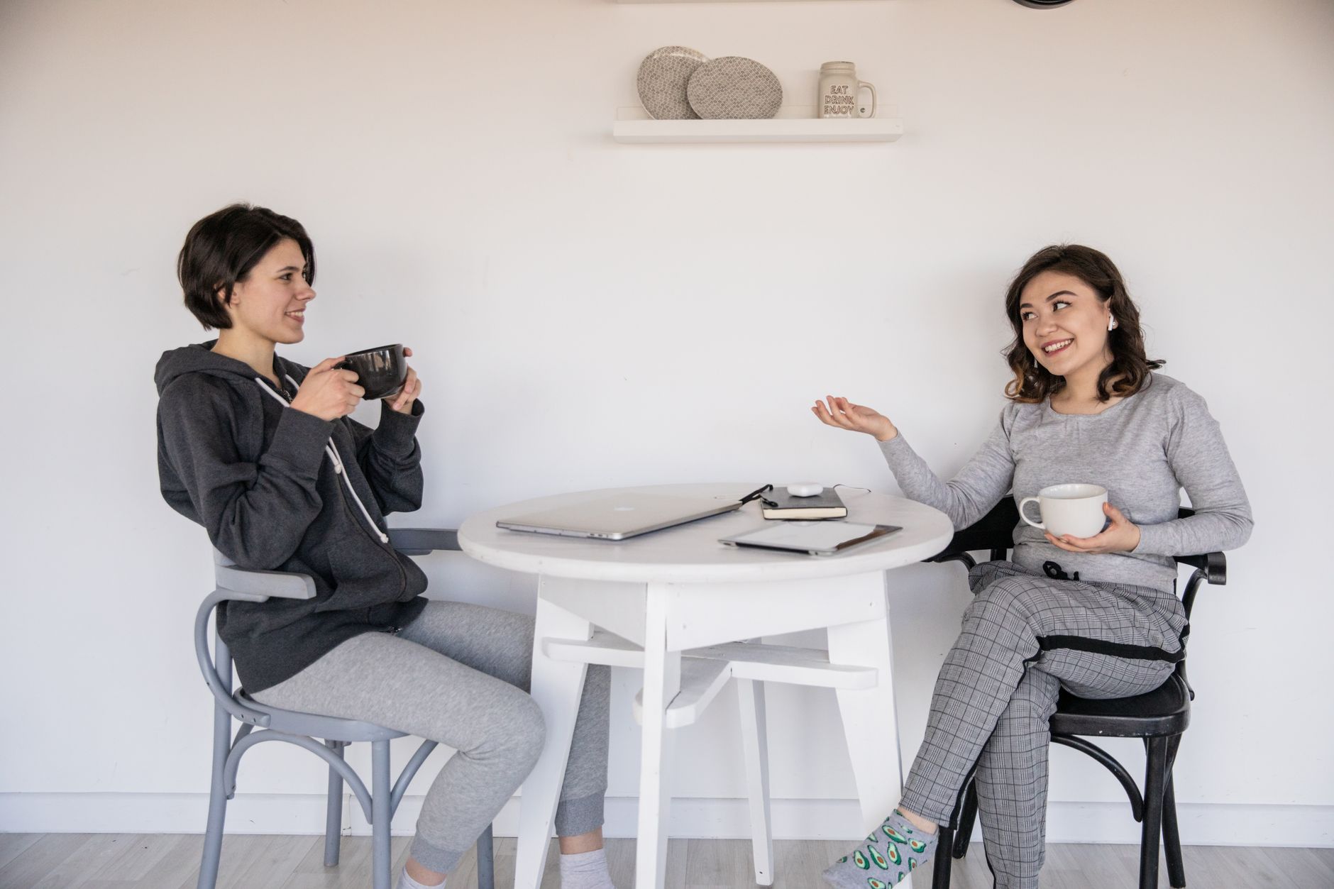 Two friends talking about where to book a beauty treatment
