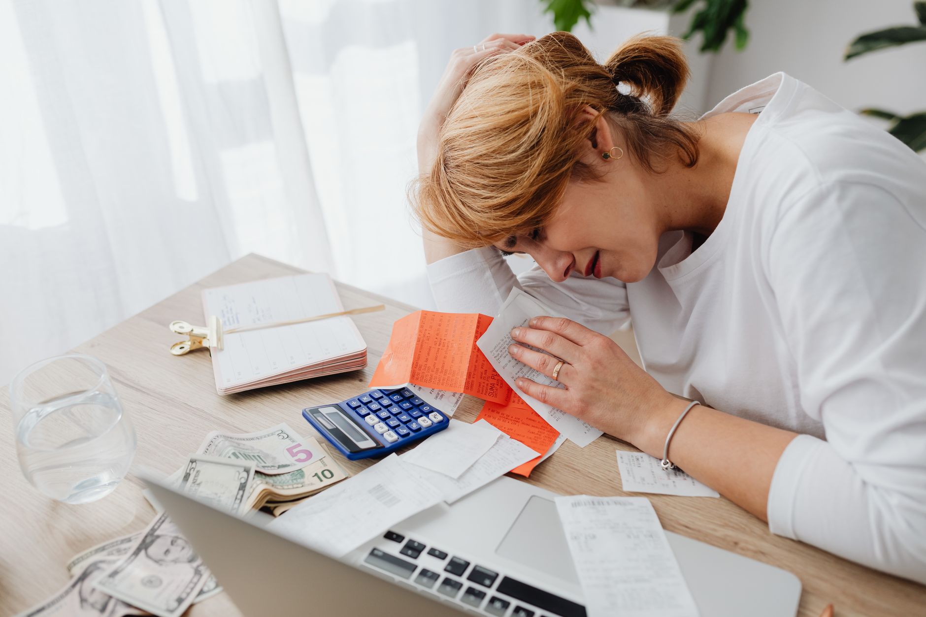 A B&B owner reviewing bookings and costs at the breakfast table