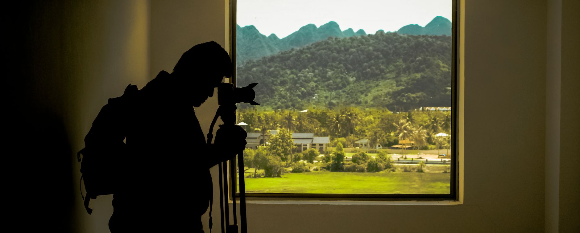 A guest taking a photo of the view from their B&B bedroom