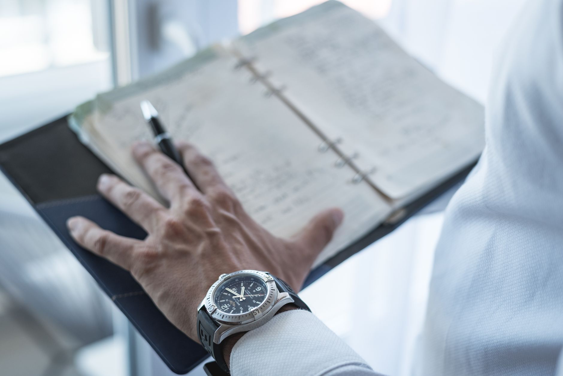 A B&B owner planning the year's marketing beside a frosty window