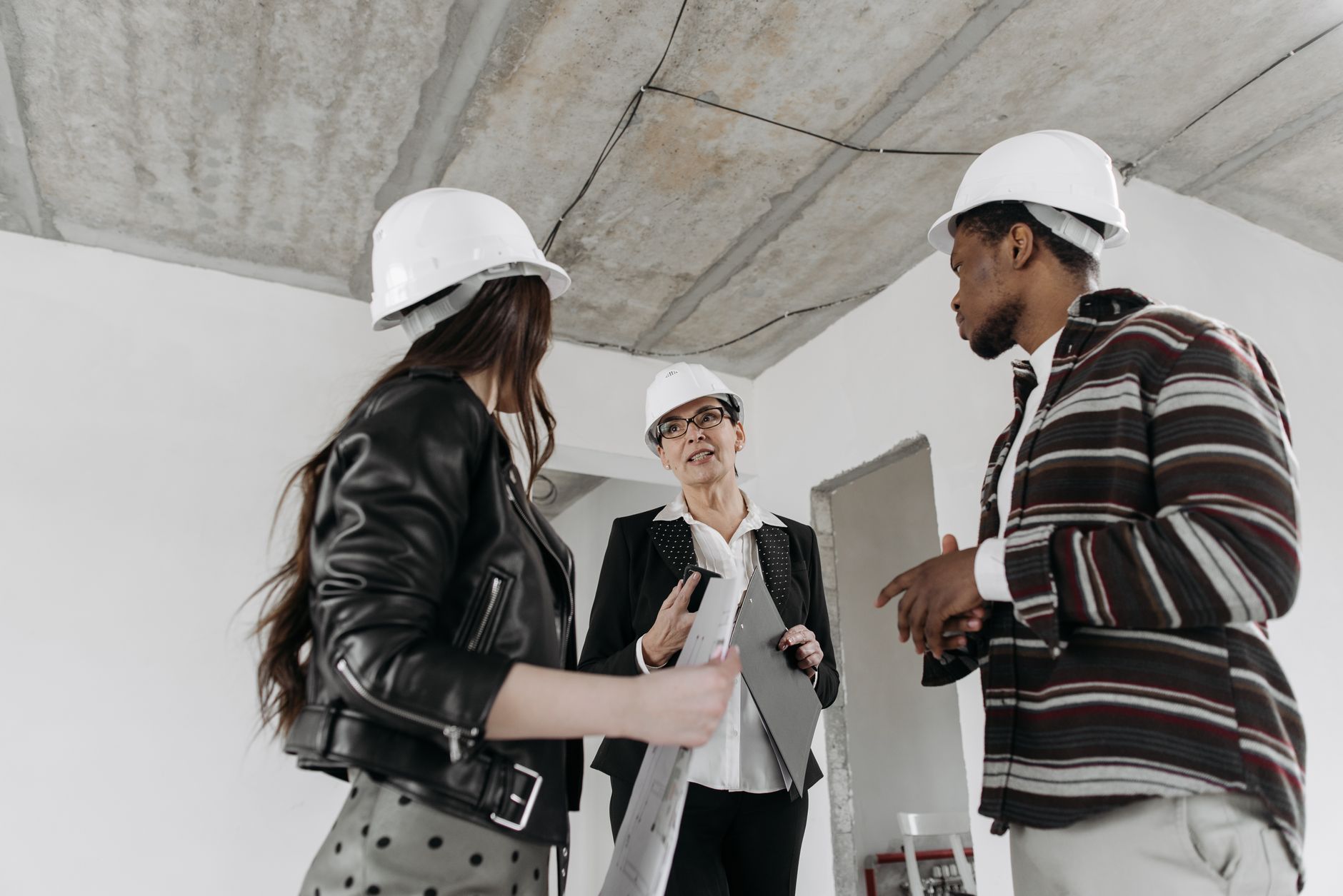 A homeowner discussing a project with a builder on the doorstep