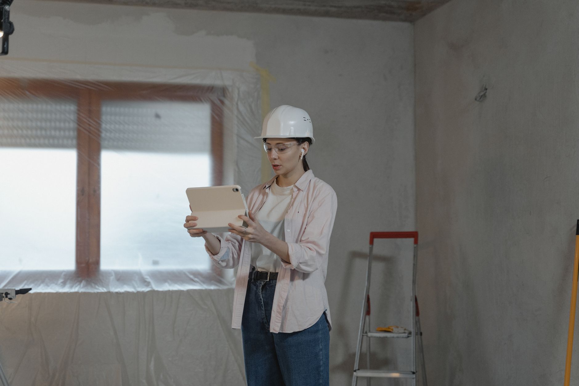 A builder showing a homeowner photos of past projects