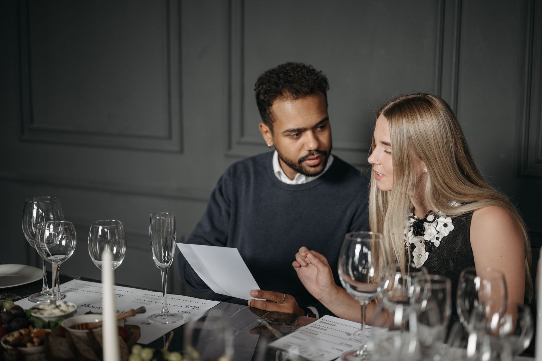 A caterer meeting a couple to talk through their wedding menu