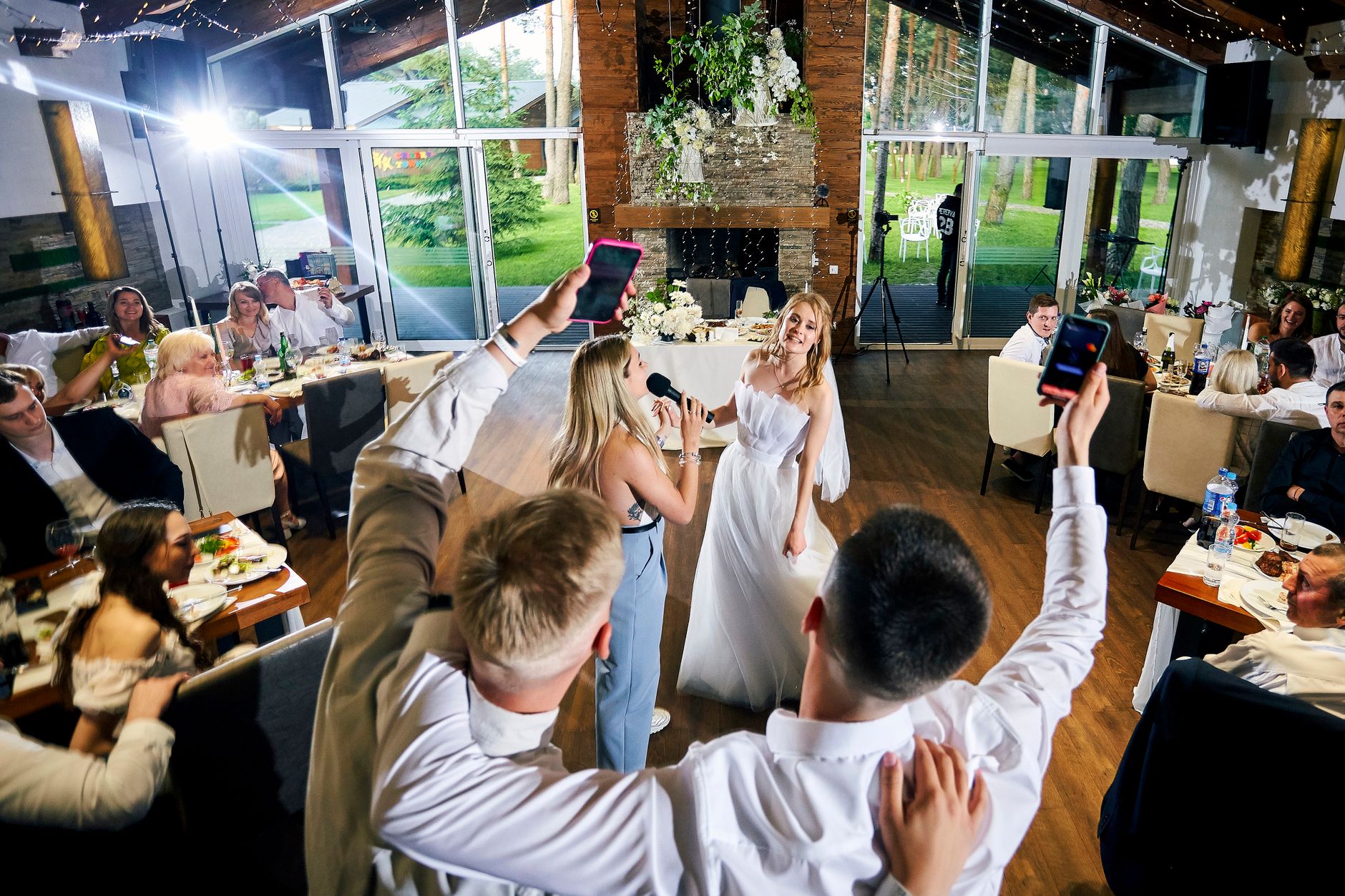 A wedding guest checking a recommendation on her phone