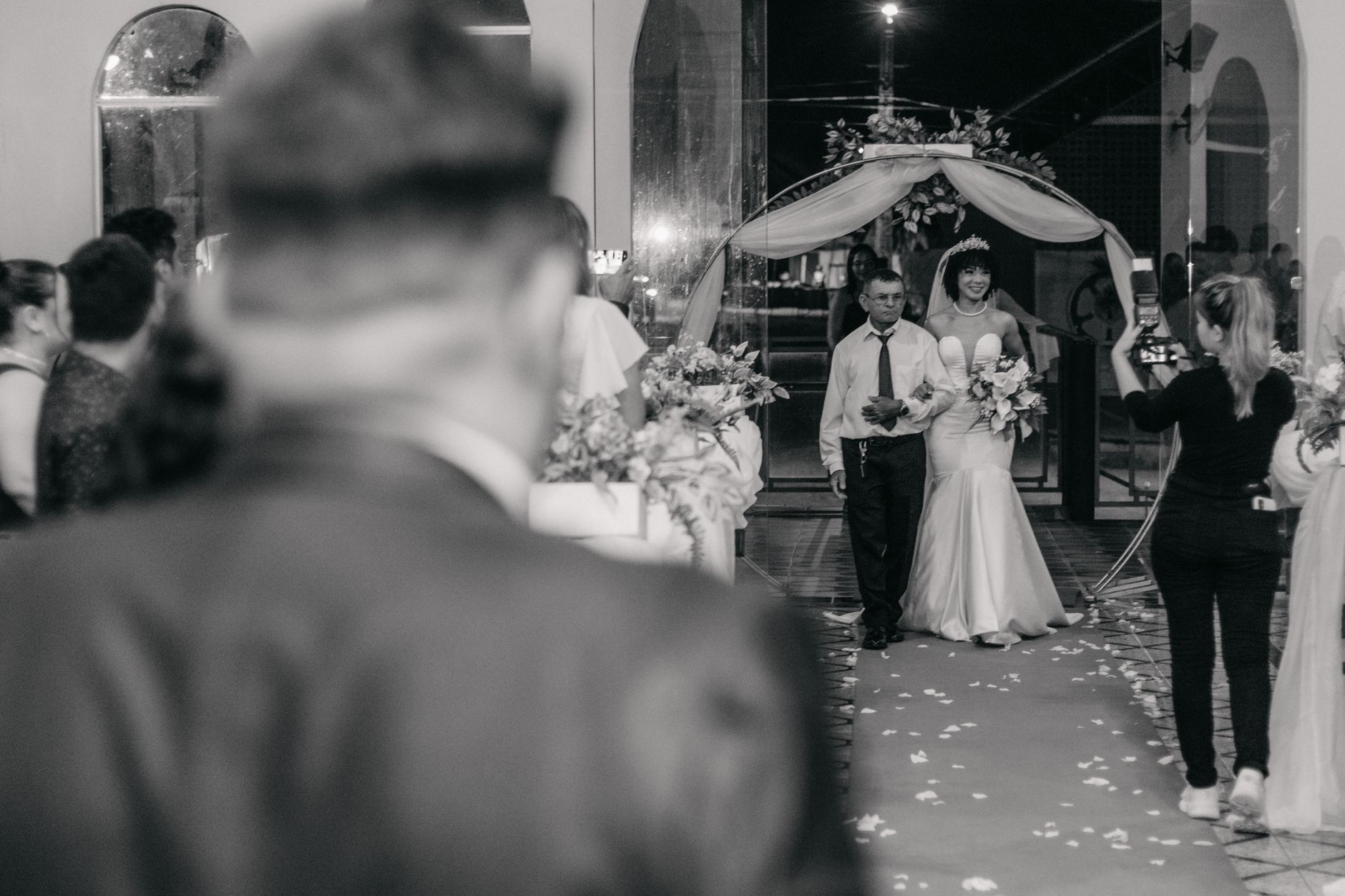 Wedding guests photographing a flaming dessert as it is served