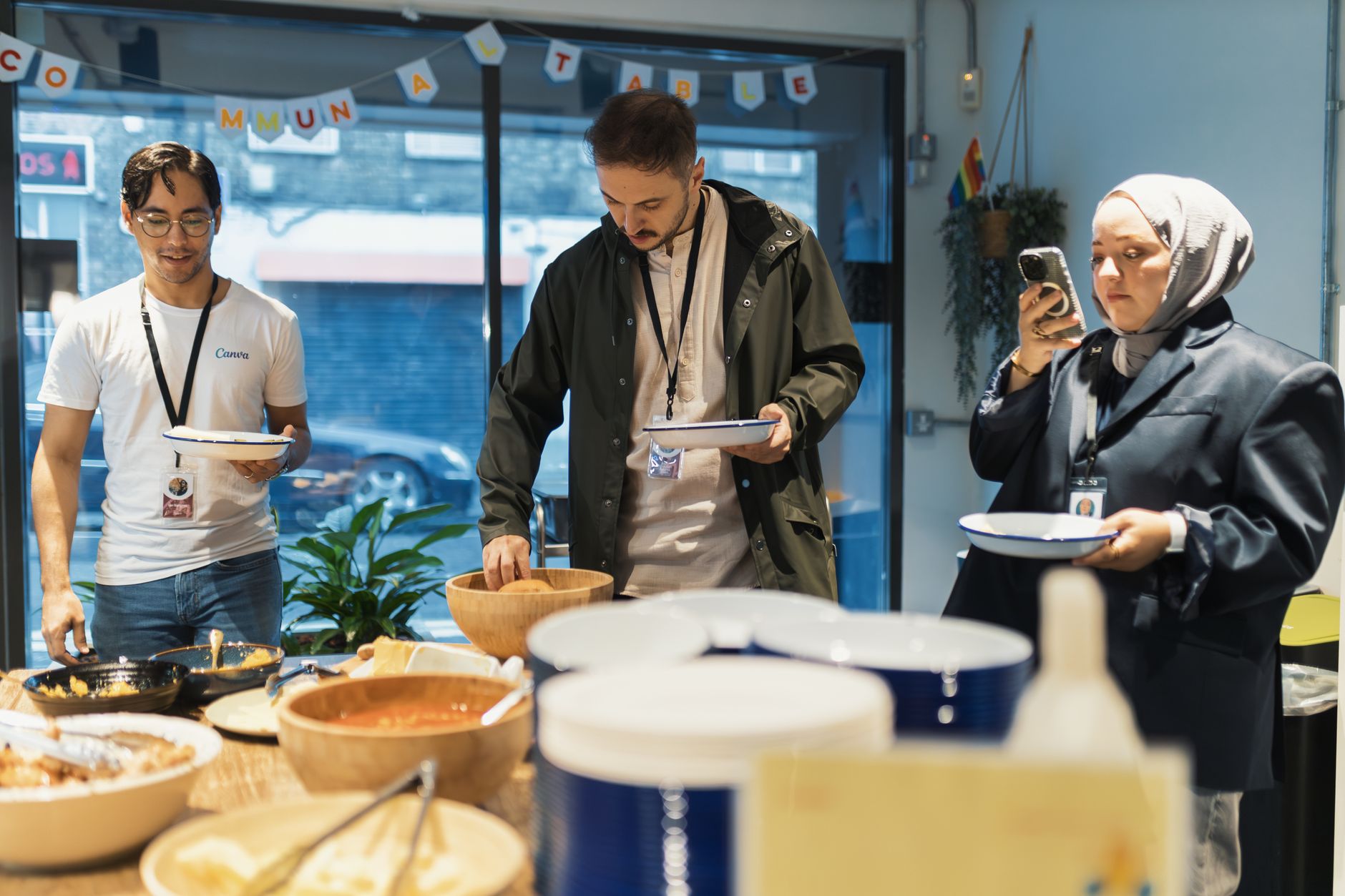 A caterer greeting a returning client at a workplace lunch