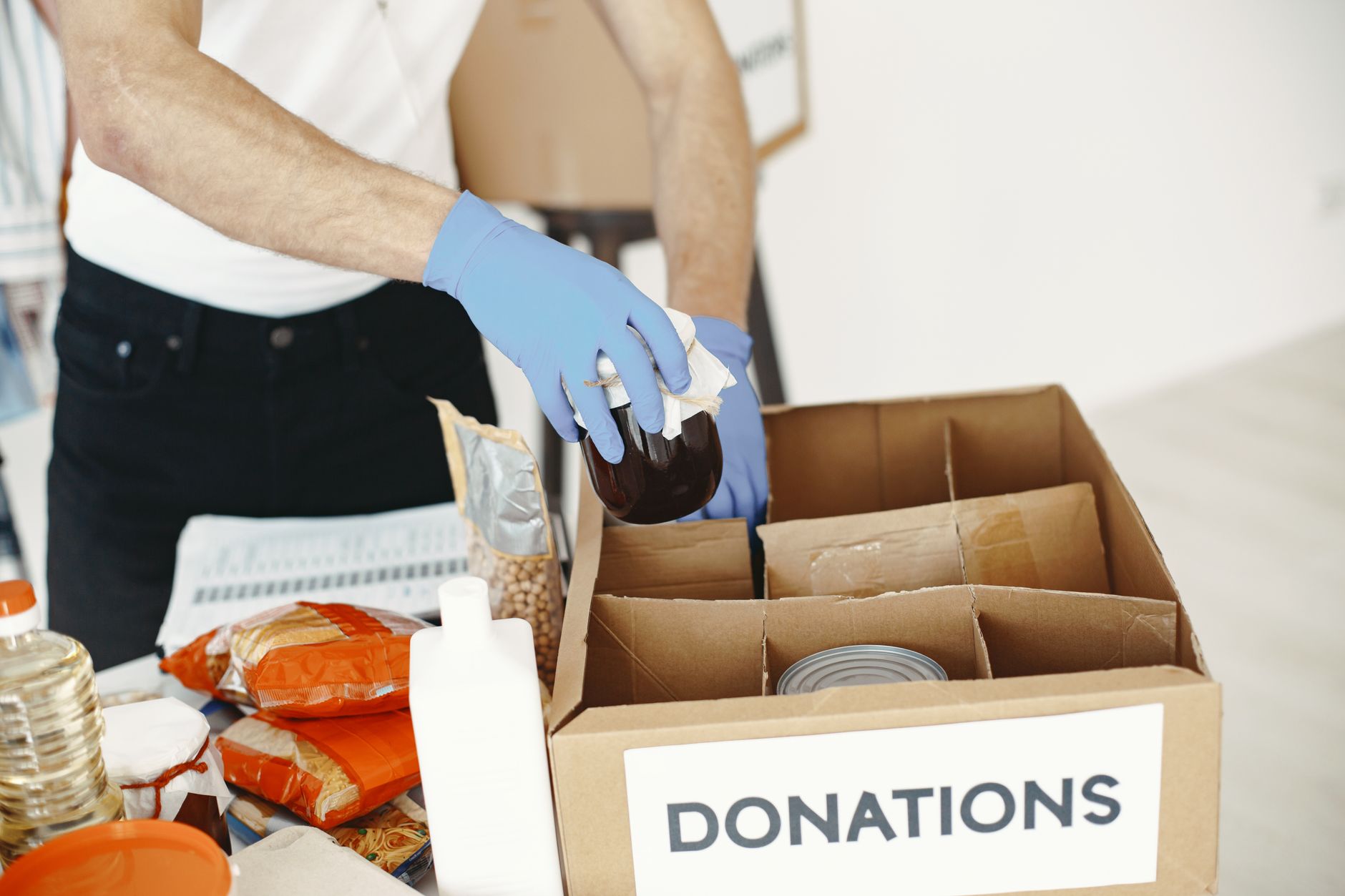 A charity worker handing over support to someone in need