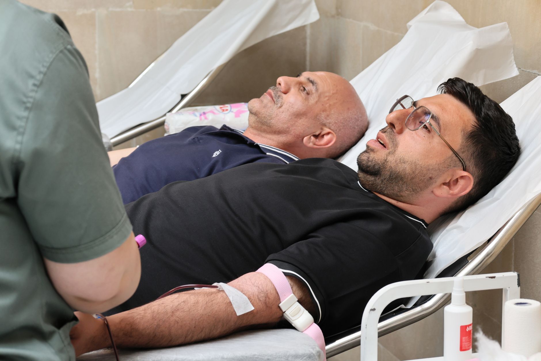 A charity worker showing a supporter the impact of their donation