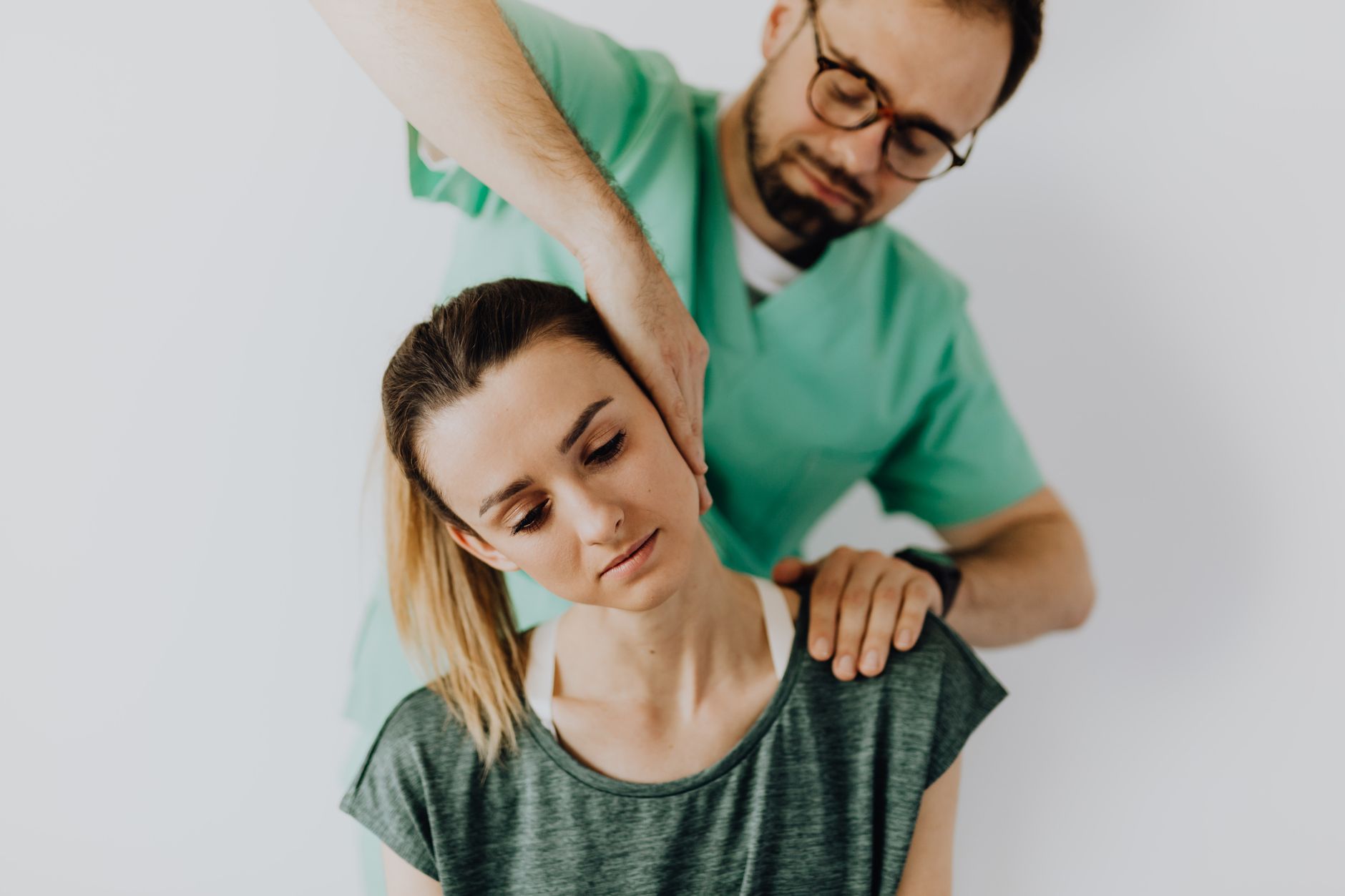 A new mother receiving chiropractic care for postnatal back pain