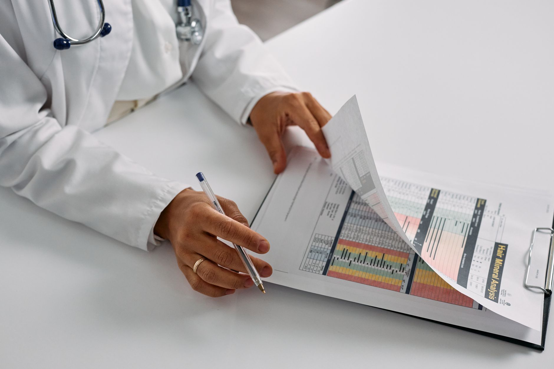 A chiropractor reviewing patient feedback to improve their approach