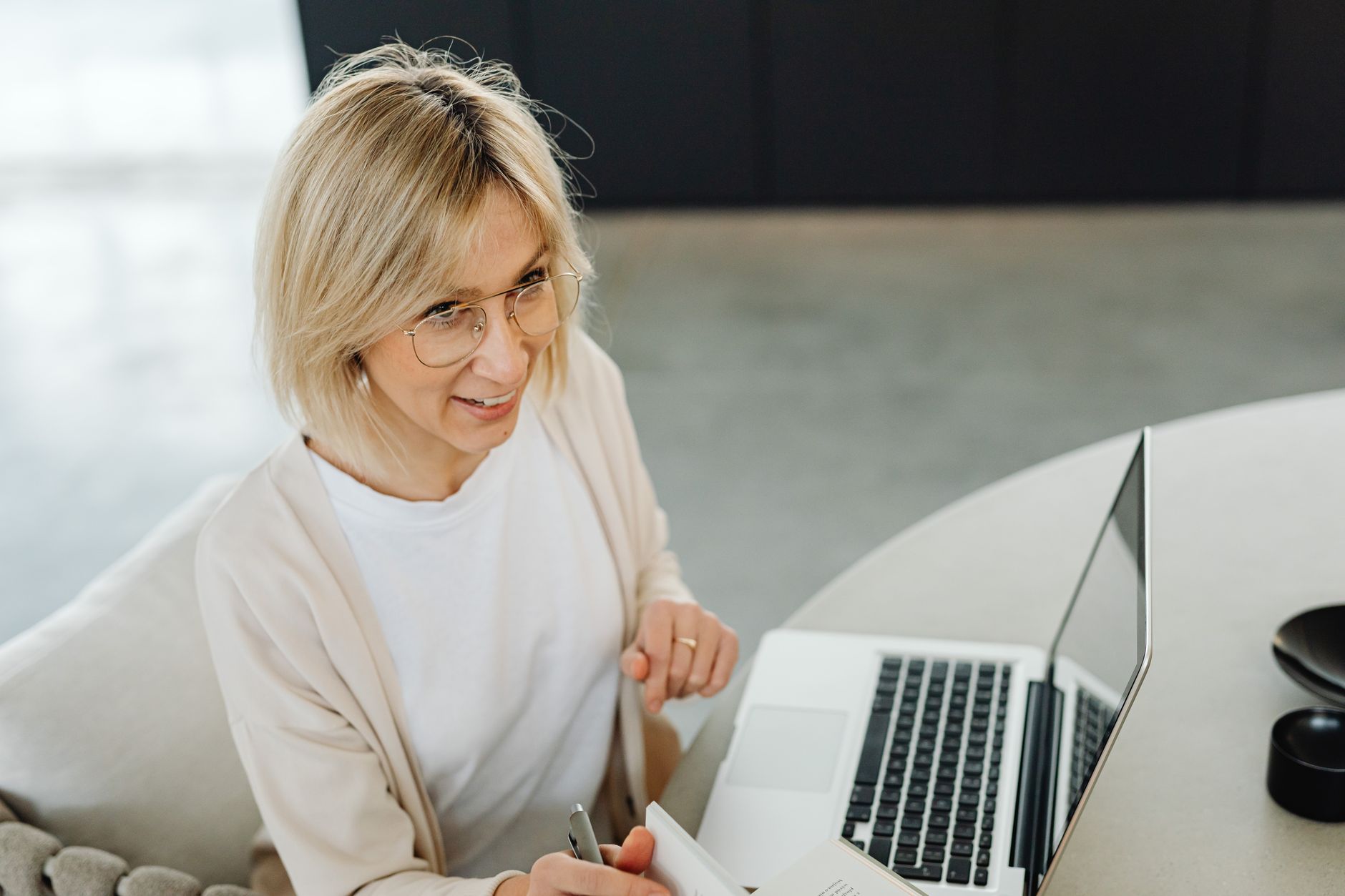 A consultant writing up a case study at their desk