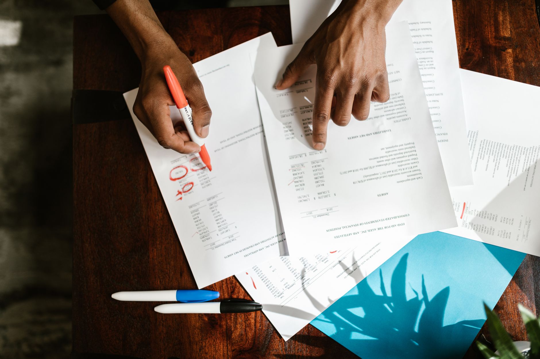 An estate agent reviewing current market figures at their desk