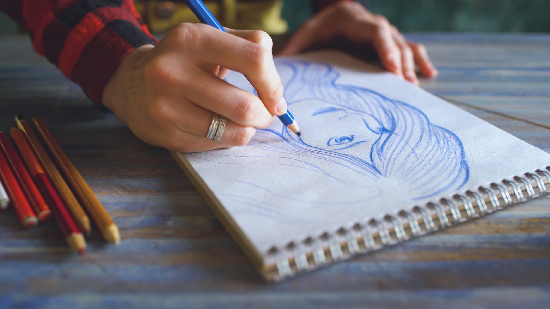 A freelance illustrator managing paperwork alongside creative work