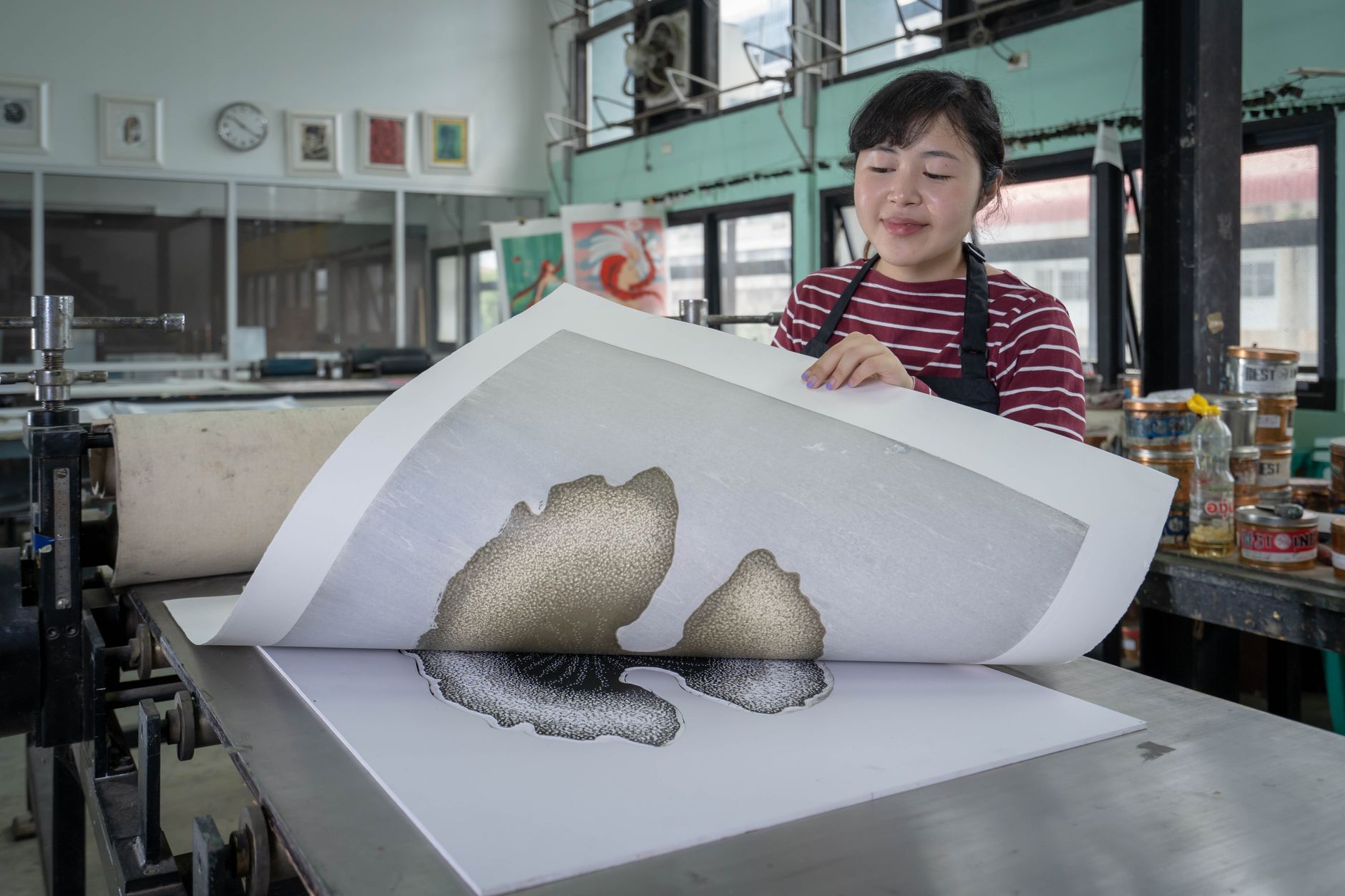 An illustrator choosing which pieces belong in their portfolio