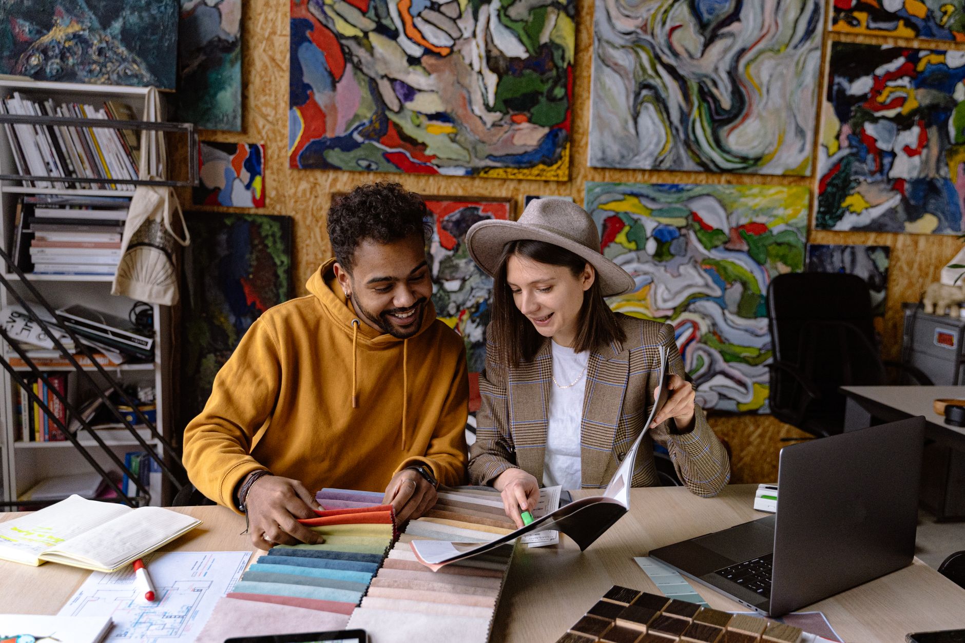 An illustrator meeting an art director to discuss a commission