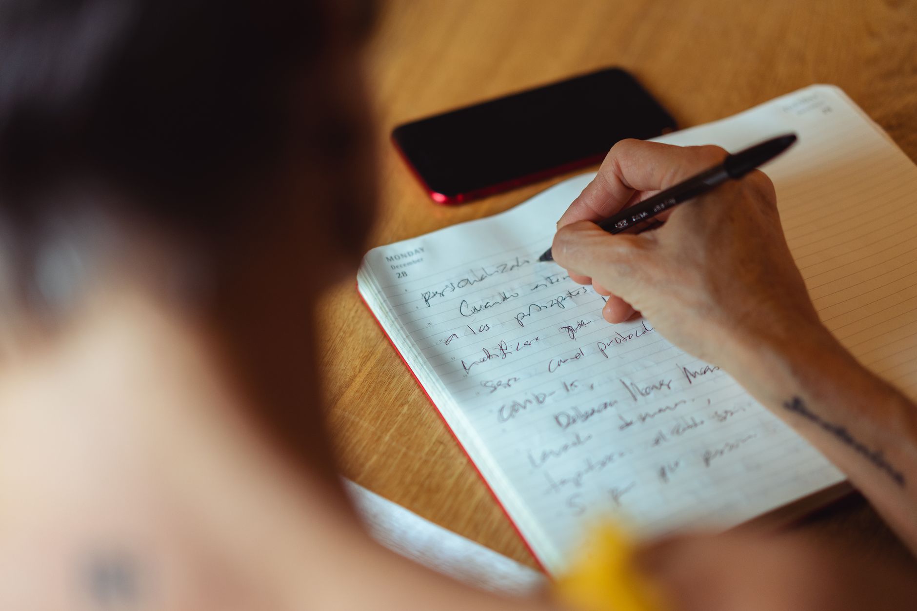 A gardener noting down jobs and follow-ups at the end of the day