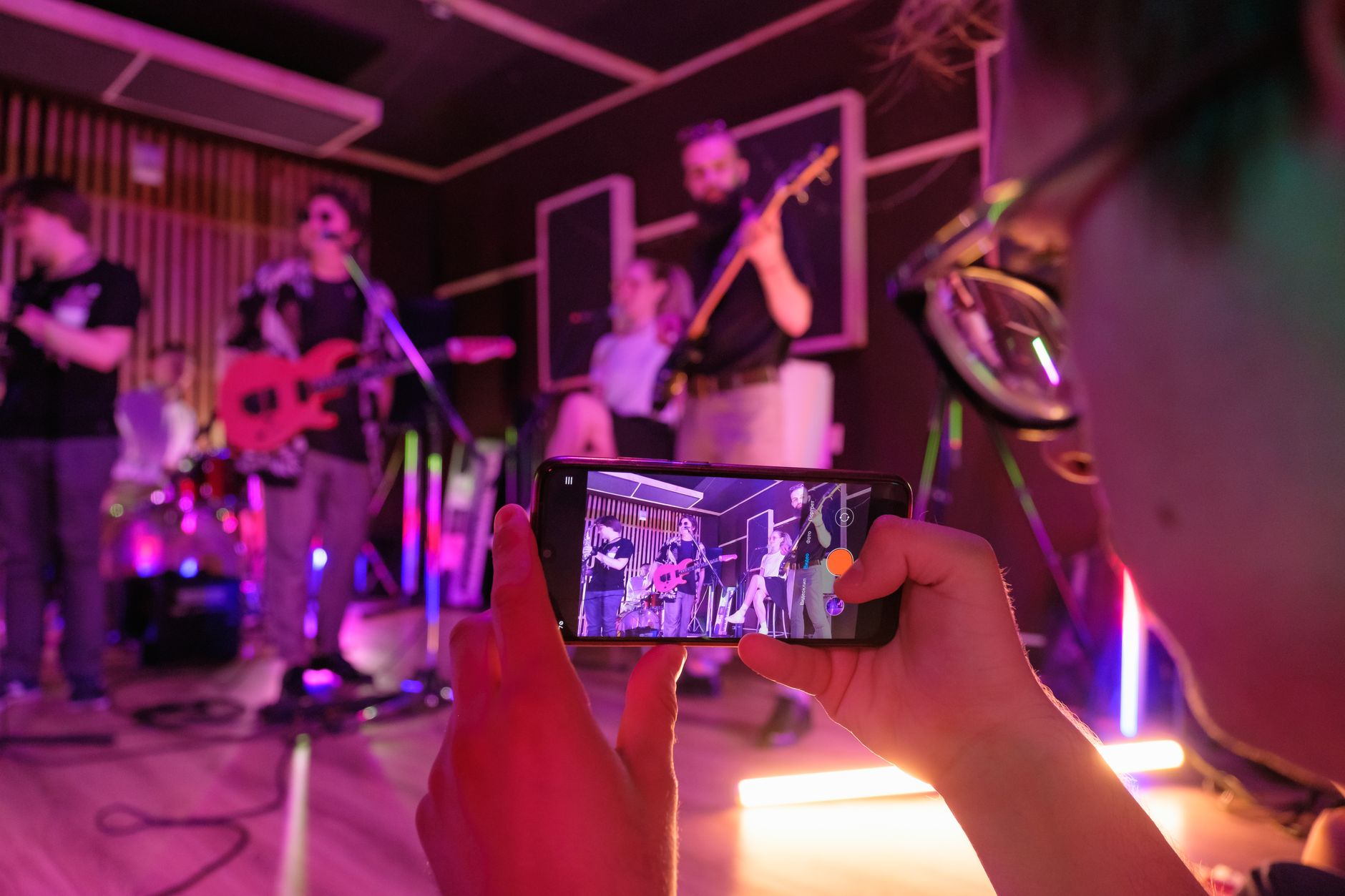A musician filming a quick update during a rehearsal session