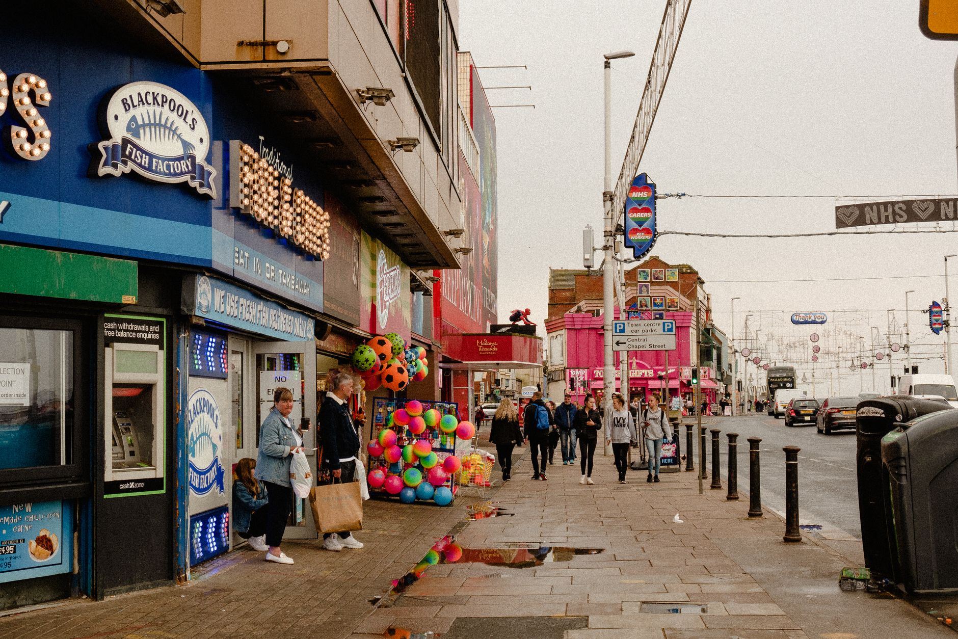 A recognisable optician shopfront on a busy UK high street