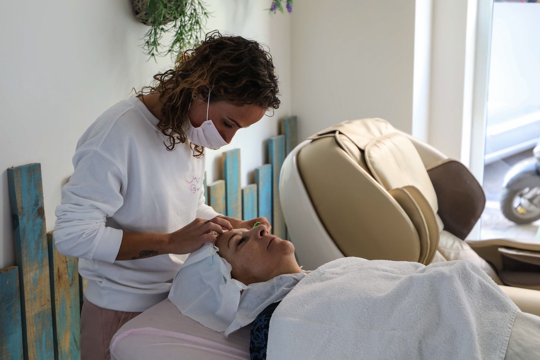 A client enjoying a calm, unhurried facial treatment