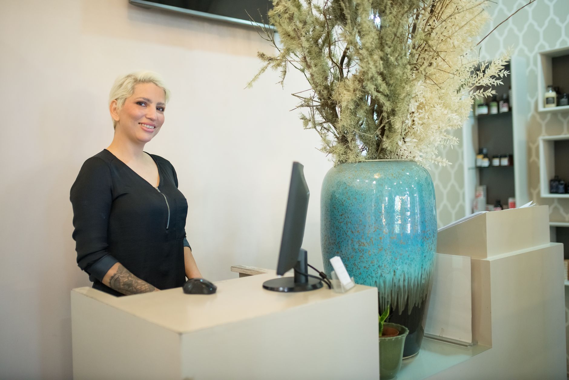 A salon owner keeping their online listing and photos current