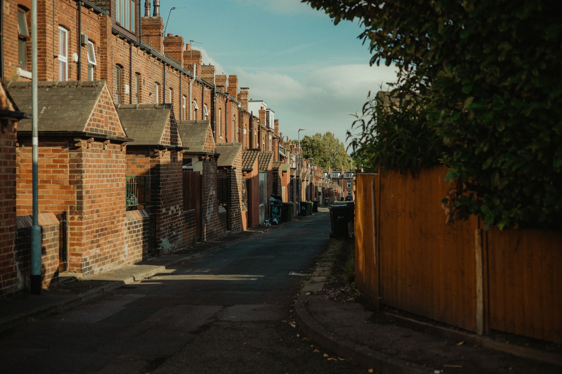 A tradesperson discussing a job with a customer outside their home