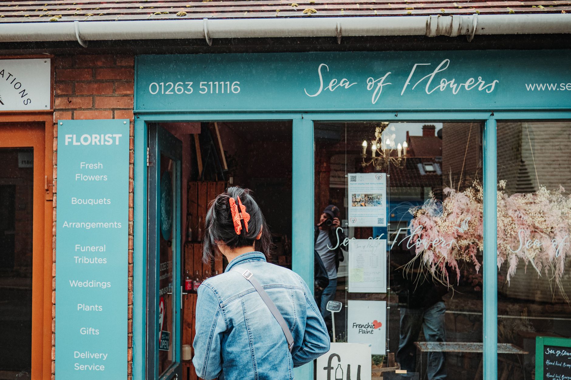 A row of independent shops on a busy UK high street