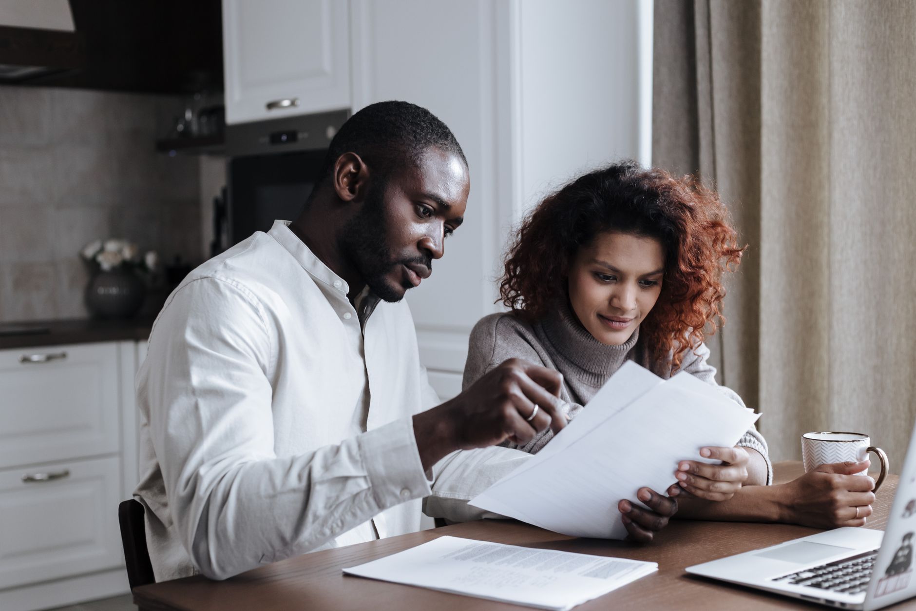 A family going through legal paperwork together at home