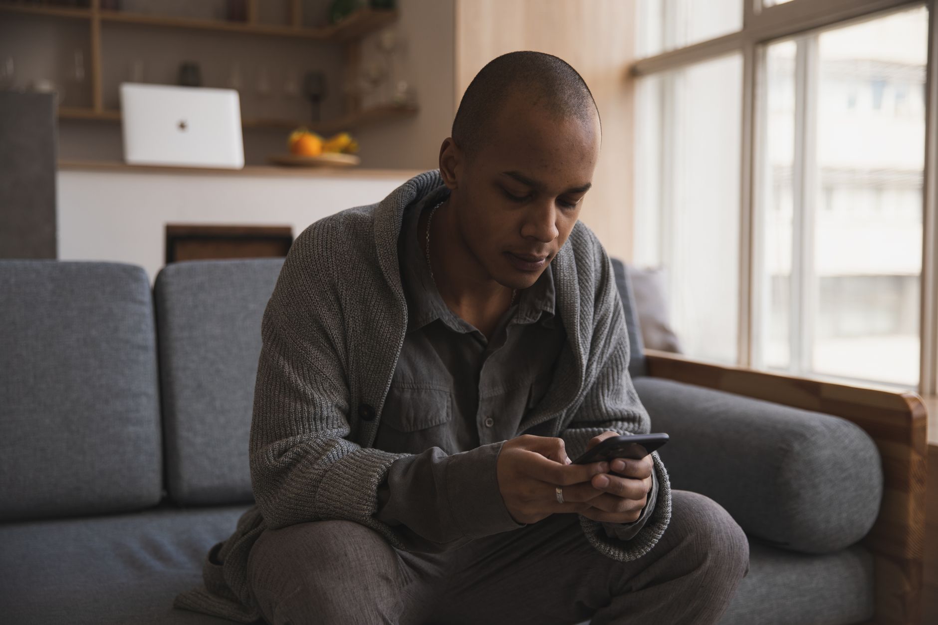 A person searching for a local solicitor on their phone at home